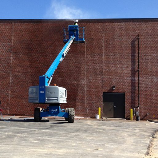 Cherry picker cleaning external walls"